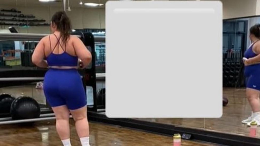 Woman teases tall woman as she works out at gym
