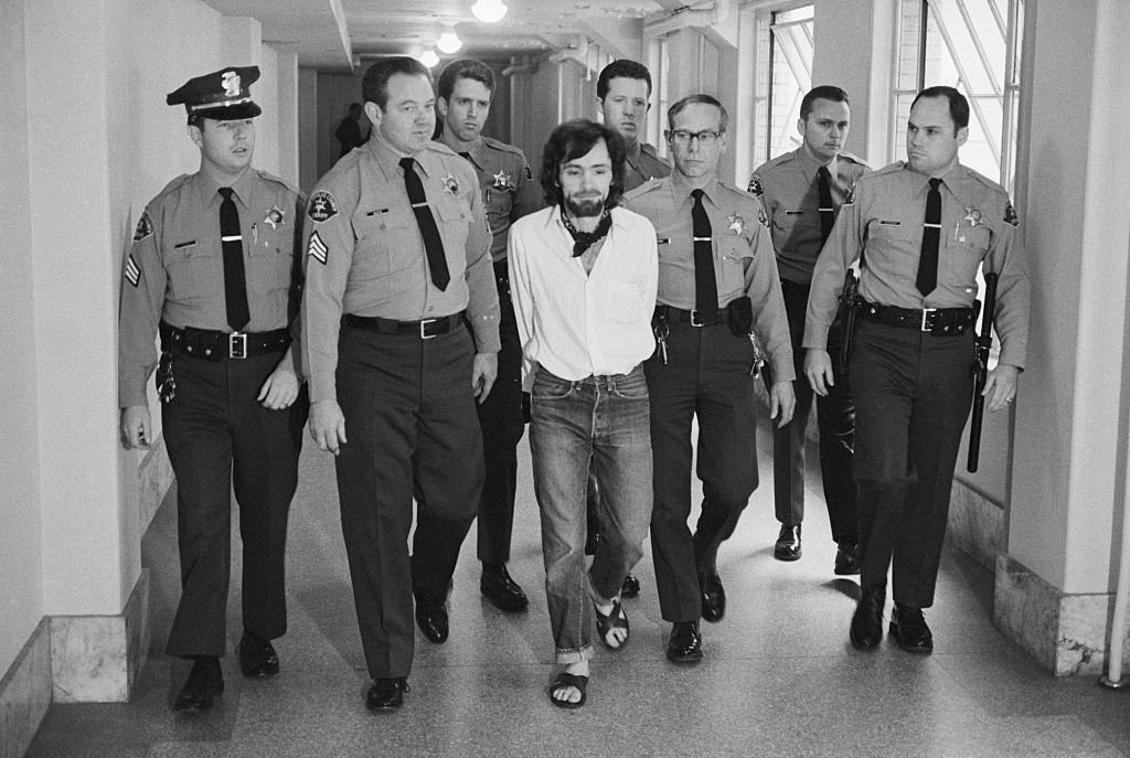 Seven deputies escort Charles Manson from the courtroom after he and three followers were found guilty of seven murders in the Tate-LaBianca slayings. | Photo: Getty Images