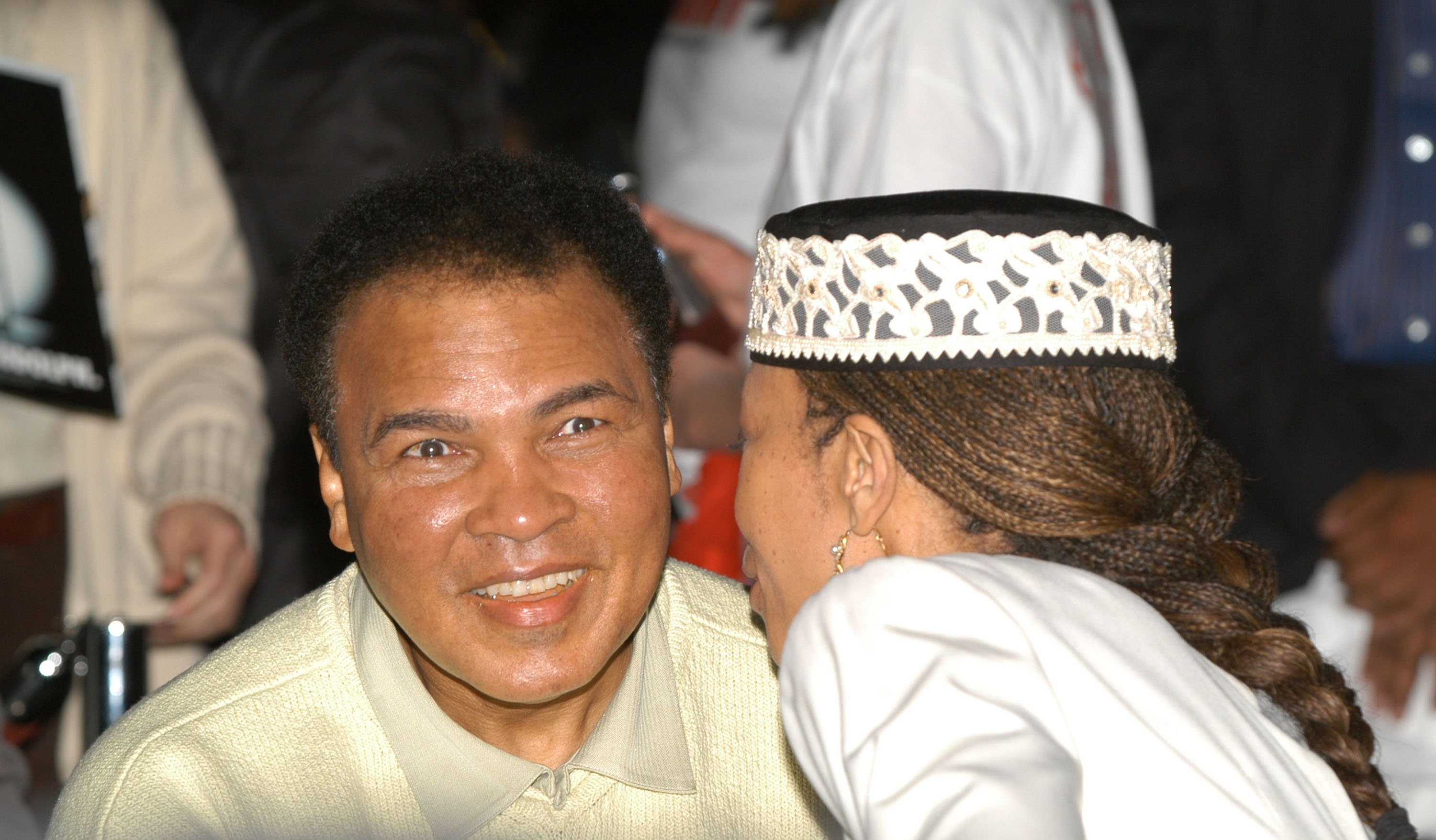 Malcolm X's daughter, Attallah, speaks with Muhammad Ali as they attend the Miami Art Basel Taschen book premiere of Muhammad Ali's book, "GOAT - Greatest Of All Time" at the Miami Convention Center December 6, 2003 in Miami, Florida.| Source: Getty Images