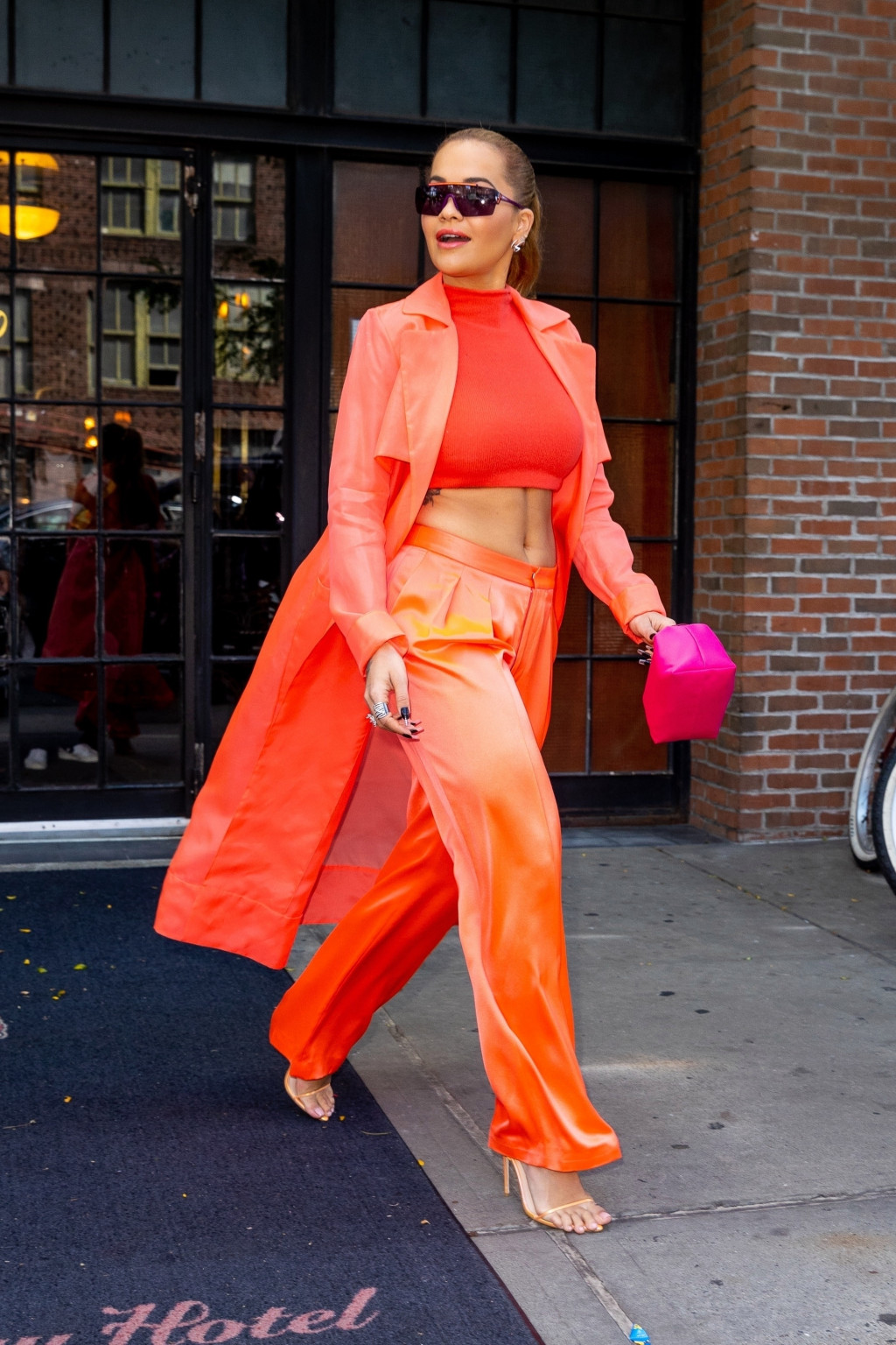 Rita Ora is radiant in all orange heading to the Prospero Tequila brunch in NYC