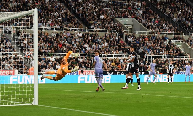 Karl Darlow of Newcastle United dives but fails to save as Raphinha of Leeds United scores their team's first goal during the Premier League match between Newcastle United and Leeds United at St. James Park on September 17, 2021 in Newcastle upon Tyne, England.