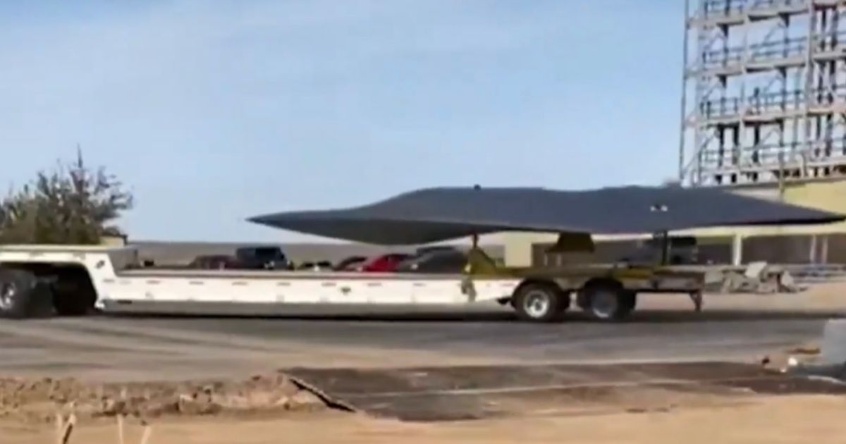 UFO frenzy as mysterious craft filmed being towed into secretive US military base