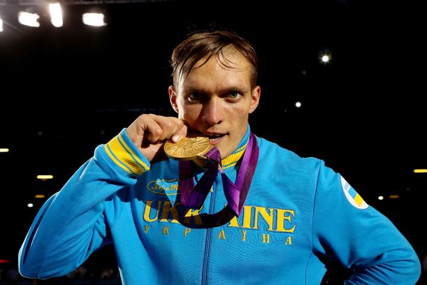 Gold medalist Oleksandr Usyk of Ukraine celebrates after the medal ceremony for the Men's Heavy (91kg) Boxing final bout on Day 15 of the London 2012 Olympic Games at ExCeL on August 11, 2012 in London, England.