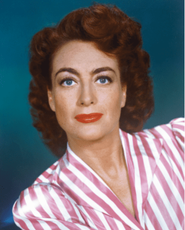 American actress Joan Crawford (1904 - 1977) wearing a pink and white striped blouse, circa 1945. | Source: Getty Images