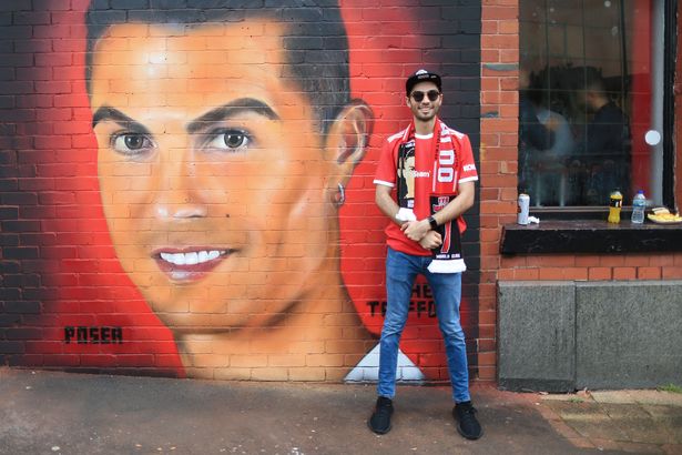 Despite similarities to Pat Butcher, some fans still took the opportunity to pose next to the strange mural