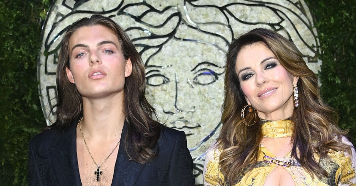 Liz Hurley and lookalike son wow with matching plunging necklines at Milan Fashion Week