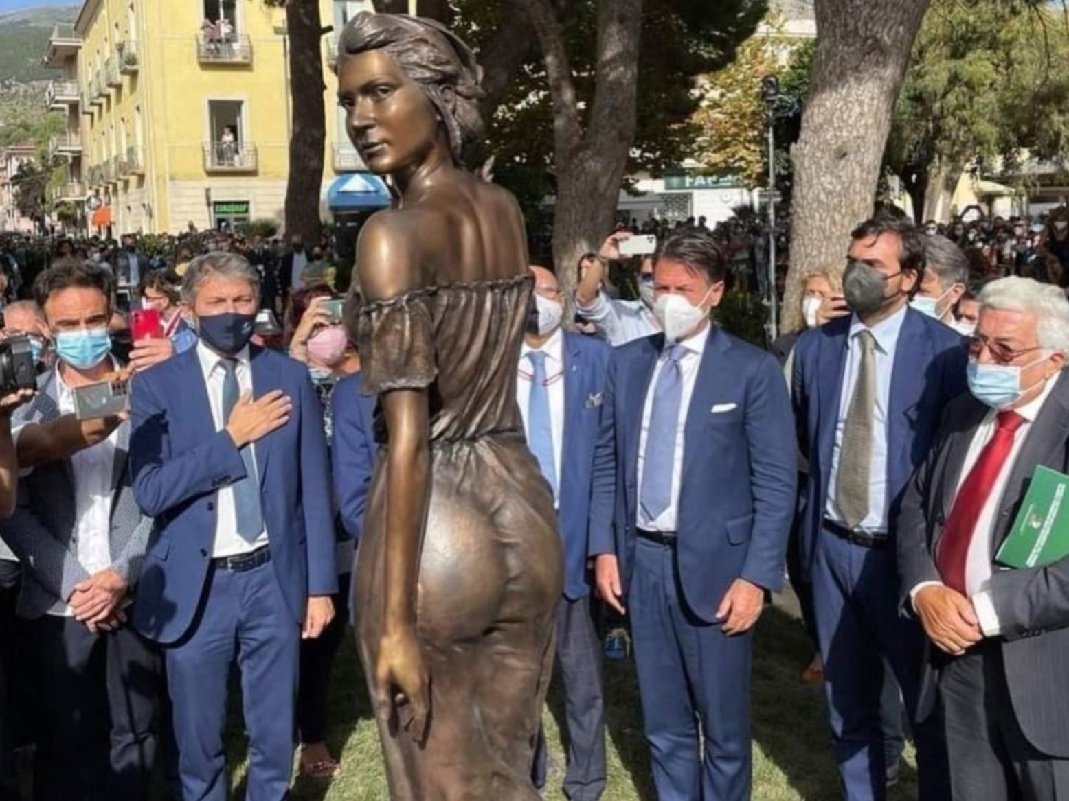 Bronze statue of woman in see-through dress sparks sexism row after it’s unveiled by group of men in Italy