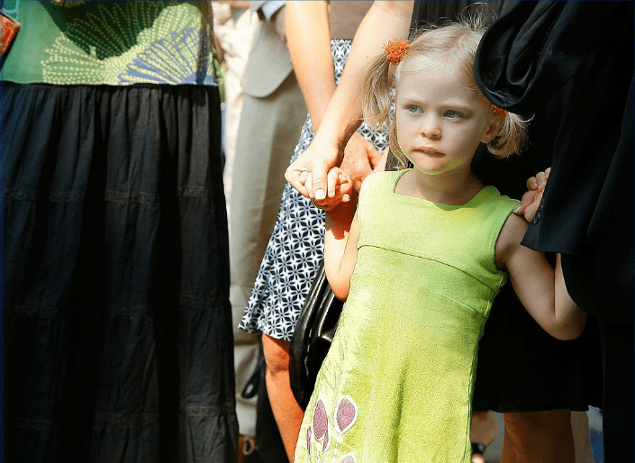 Seven year-old Sophie Ostroy, daughter of Adrienne Shelly listens as her father Andy Ostry speaks at the Adrienne Shelly Memorial Garden dedication ceremony at Abingdon Square Park on August 3, 2009 in New York City. |Source: Getty Images