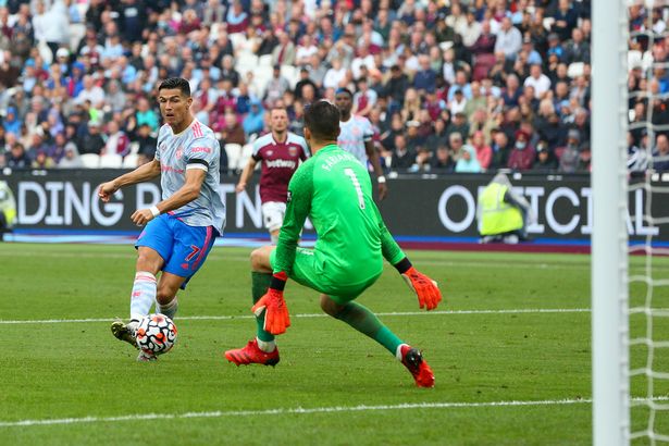 Cristiano Ronaldo of Manchester United has a shot at goal during the Premier League match between West Ham United and Manchester United at London Stadium on September 19, 2021 in London, England.