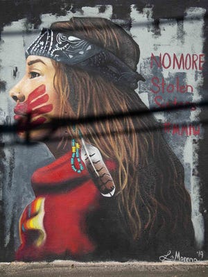 A Missing and Murdered Indigenous Women mural by artist Lucinda Yrene is seen in April at the Churchill in Phoenix.