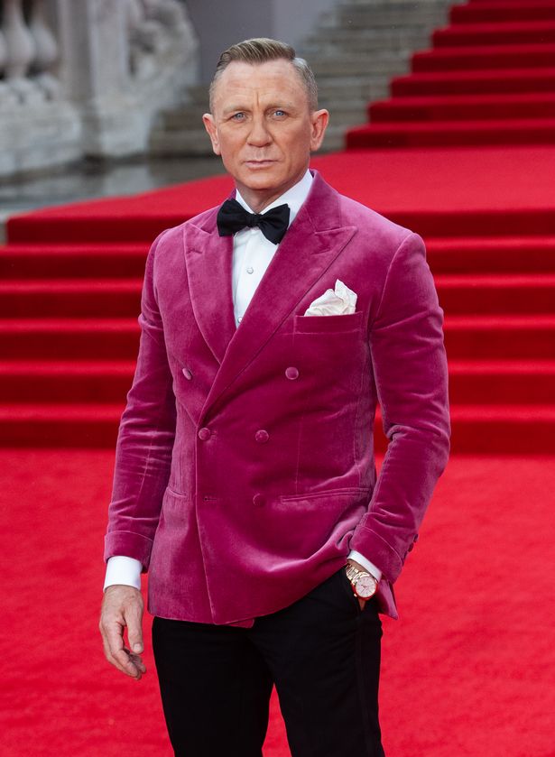 Daniel Craig wore a pink suede dinner jacket for the world premiere red carpet of his swan song Bond movie No Time To Die on Tuesday evening