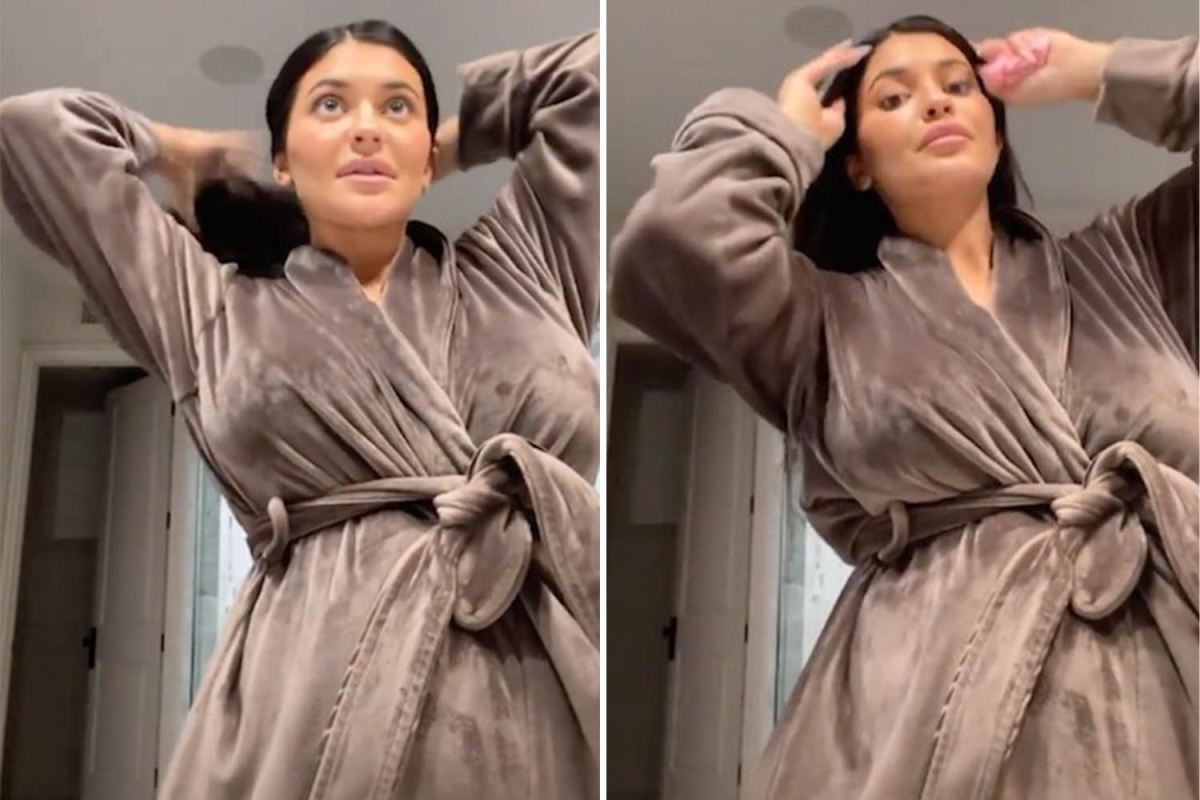 Pregnant Kylie Jenner goes makeup-free as she shows off her growing baby bump in just a bathrobe
