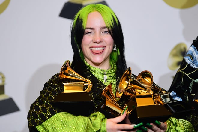 Billie Eilish opens up about why she transformed her previous bright green locks to a more subdued blonde. "I couldn’t go anywhere with that hair because it was so obviously me," she tells Elle magazine in a September interview.