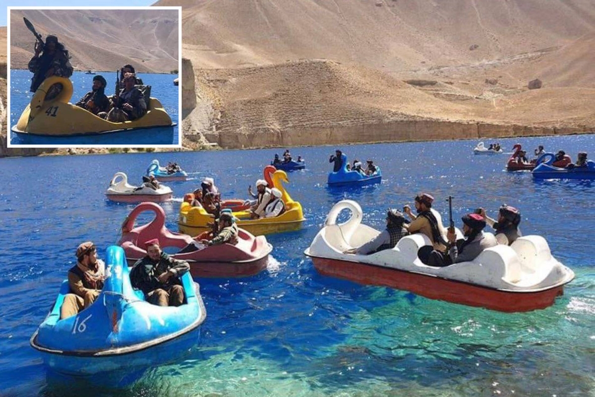 Taliban fighters ride swan-shaped pedalos in Afghanistan’s only national park amid protests over ban on women working