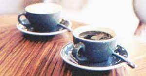 Waiters are puzzled when an lady orders two cups of coffee every day but only drinks one