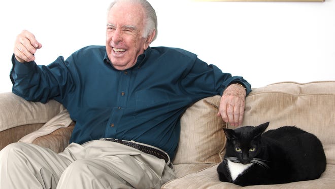 Composer Carlisle Floyd shares a laugh and the sofa. His cat, Tina, was a rescue. Floyd, who is in his mid-80s, is working on a new opera. Mike Ewen/Democrat files
Carlisle Floyd sits inside his Tallahassee home with his feline friend, Tina. Famed opera composer Carlisle Floyd is being honored with a tribute concert at Florida State on Sept. 24 in Ruby Diamond Auditorium. He recently returned from Australia where his opera was performed.