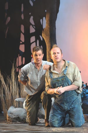 George (Bret Thom) tells Lennie (Luke Selker) to picture the farm they are going to own one day, in Florida State Opera's "Of Mice and Men."