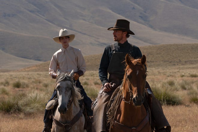 Volatile cowboy Phil (Benedict Cumberbatch, right) shows young Peter (Kodi Smit-McPhee) the ropes in Jane Campion's "The Power of the Dog."