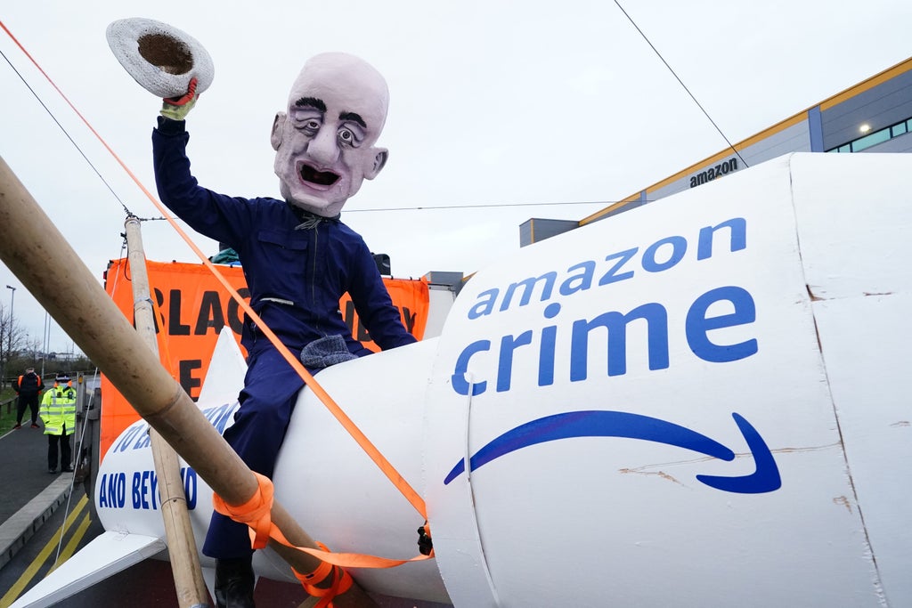 Black Friday protests: Jeff Bezos caricature rides rocket as Extinction Rebellion block 15 Amazon depots