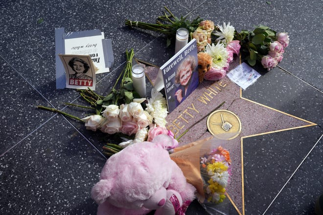 A memorial to Betty White at her star on the Hollywood Walk of Fame following news of her death at age 99.