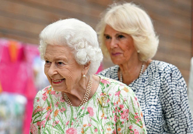 Queen Elizabeth II and her daughter-in-law, Camilla Duchess of Cornwall, attend an event during the G7 summit in Cornwall, June 11, 2021.