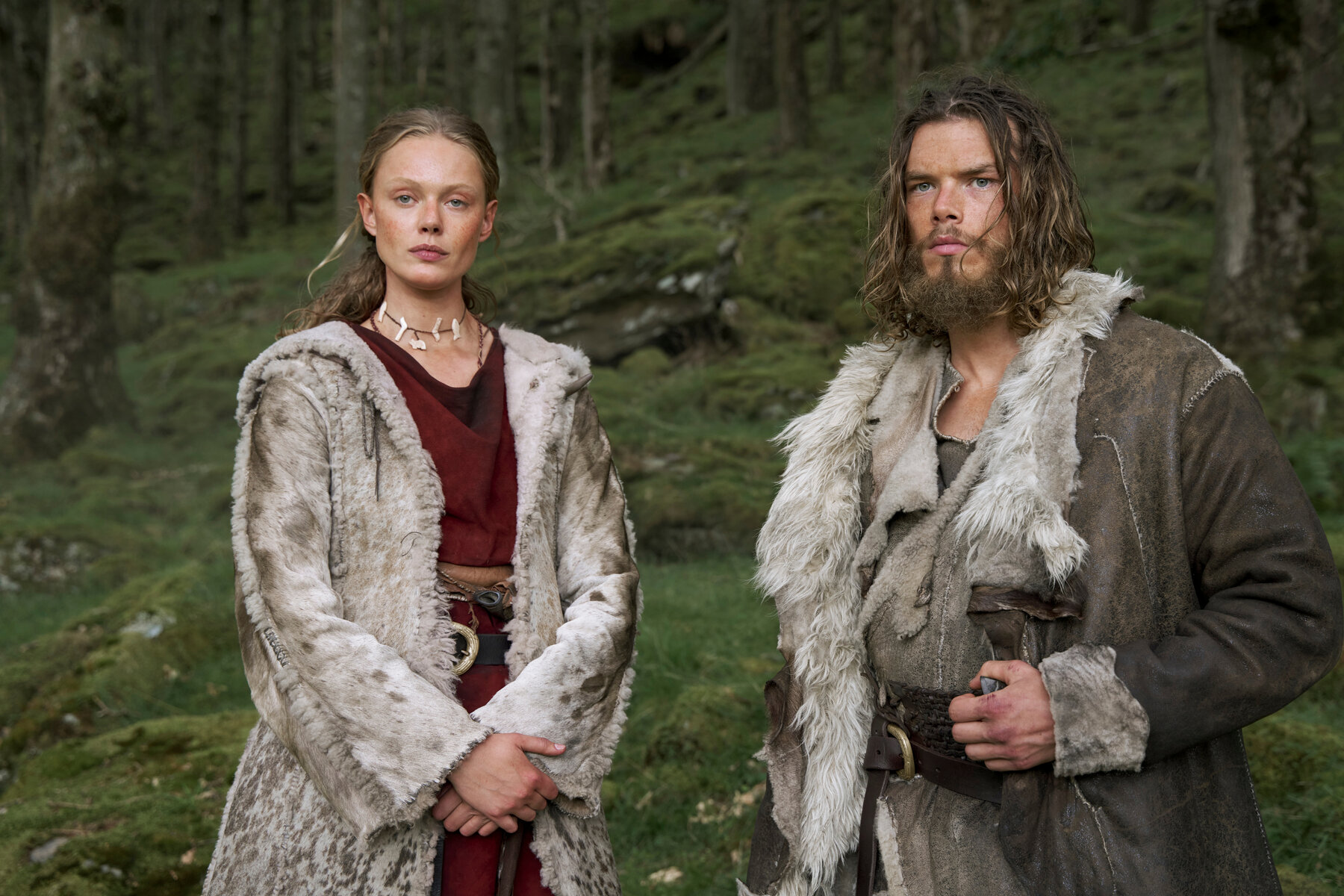 viking man and woman stand beside each other