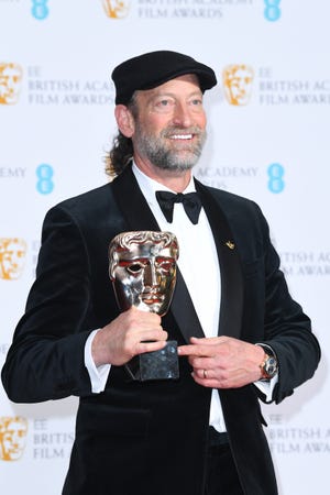 Troy Kotsur poses in the winners room with the award for Best Supporting Actor for "Coda" during the EE British Academy Film Awards 2022 at Royal Albert Hall on March 13, 2022 in London, England.