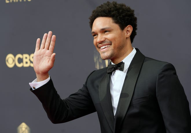 Trevor Noah, shown at the 2021 Emmy Awards, will host the Grammys for the second consecutive year.