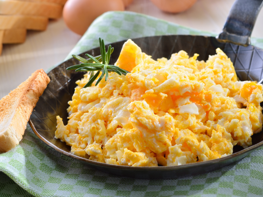 Why Adding Water To Scrambled Eggs Will Make Them Extra Fluffy