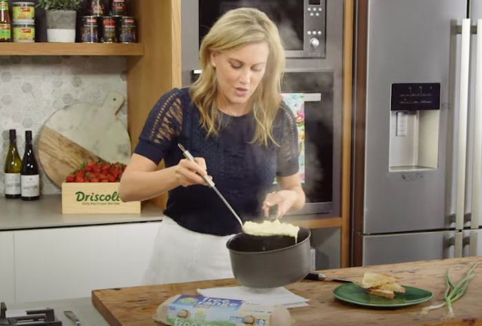 Everyday‌ ‌Gourmet‌ ‌chef ‌Justine ‌Schofield lifts poached scrambled eggs from a pot