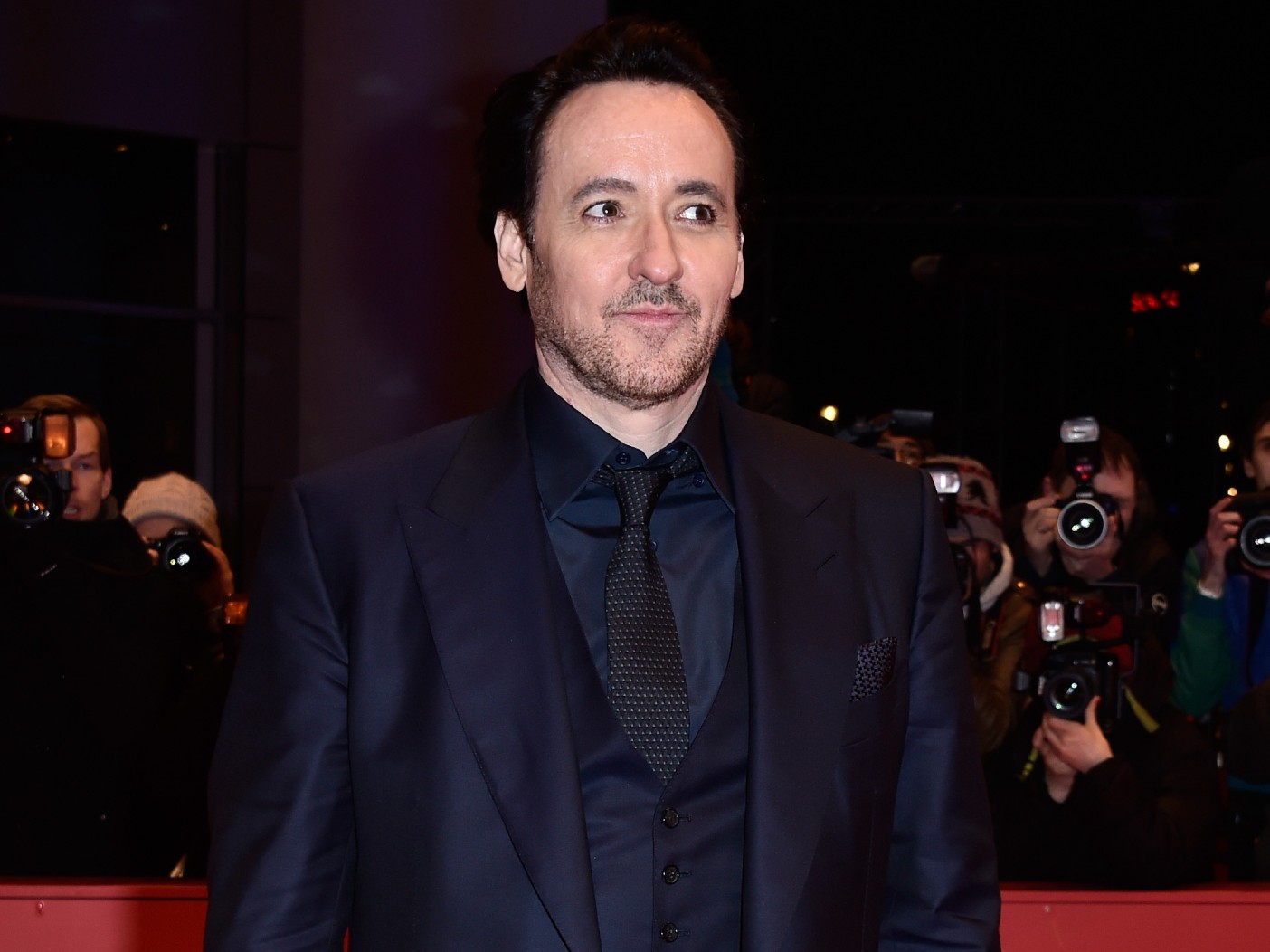 John Cusack Is Following The Nicolas Cage Playbook And We’re Not Sure Why