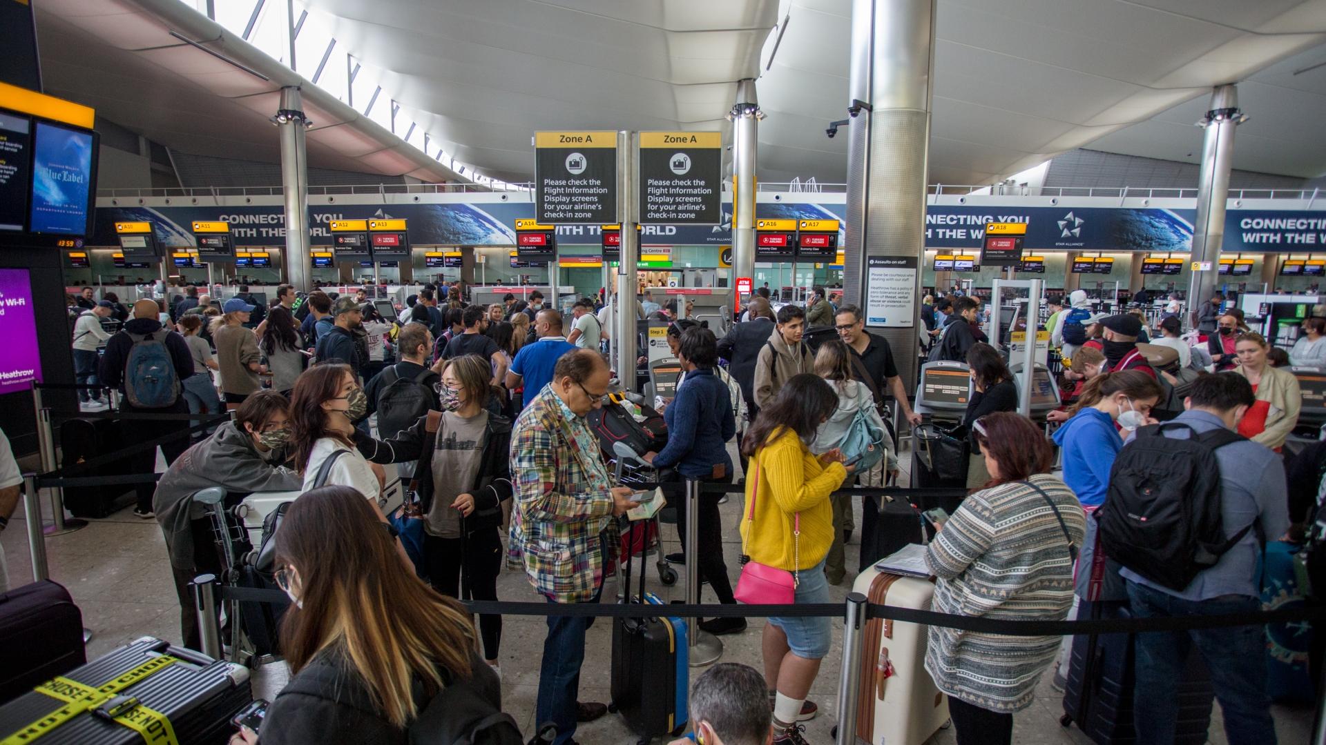 Travel chaos when departures at Heathrow are halted & passengers are made to wait for hours for their baggage