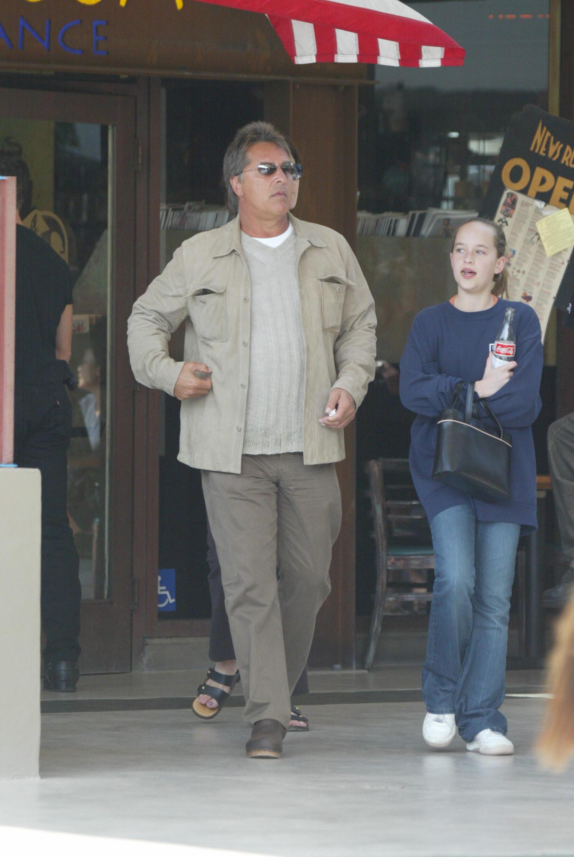 Actor Don Johnson leaves the Newsroom restaurant after having lunch with his daughter Dakota from his marriage to Melanie Griffith March 30, 2002 in Los Angeles, California | Source: Getty Images