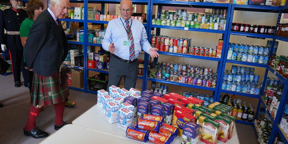Charles makes a donation to Wick-based food bank