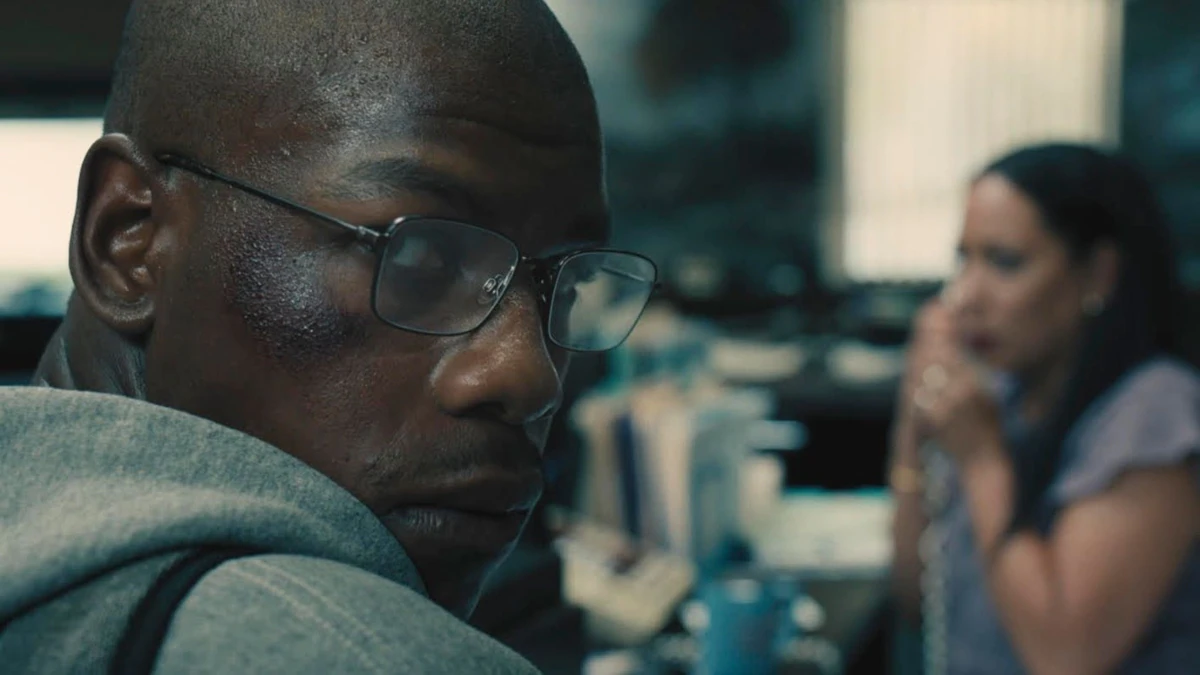 In the ‘Breaking Trailer’, John Boyega tries to rob a bank.