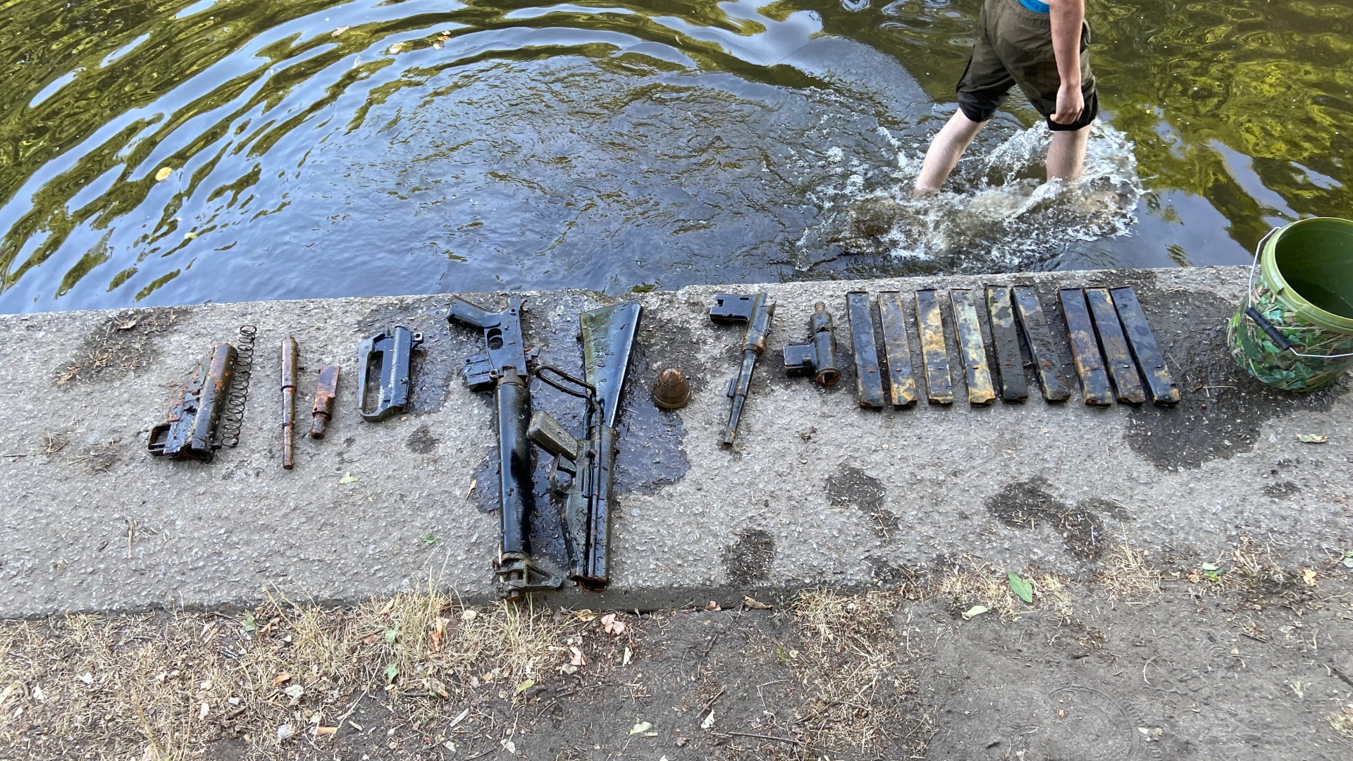 Dad in shock after teen discovers cache of FIREARMS left behind in London river during family outing
