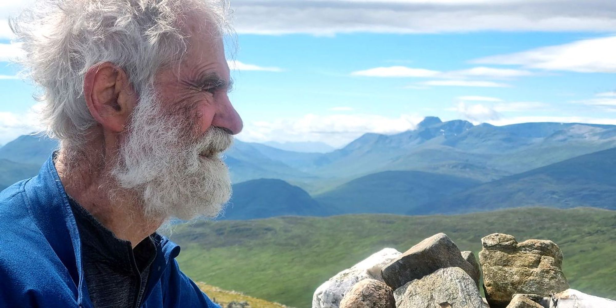 Climber, 82 to reach the final peak of the 282 Munro Challenge