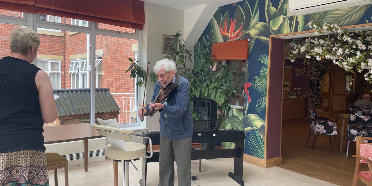 Man gives back the gift of music and reunites with his former teacher who has dementia