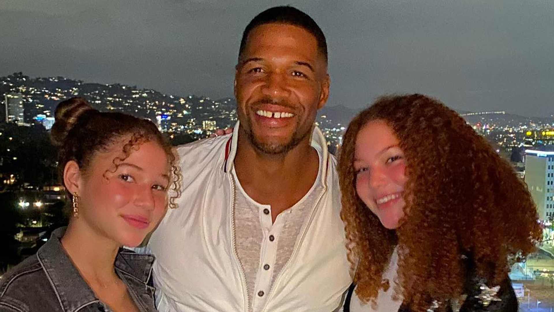 Michael Strahan’s twins Isabella & Sophia, 18, match in crop tops as they ‘put a smile’ on dad’s face in sweet new clip
