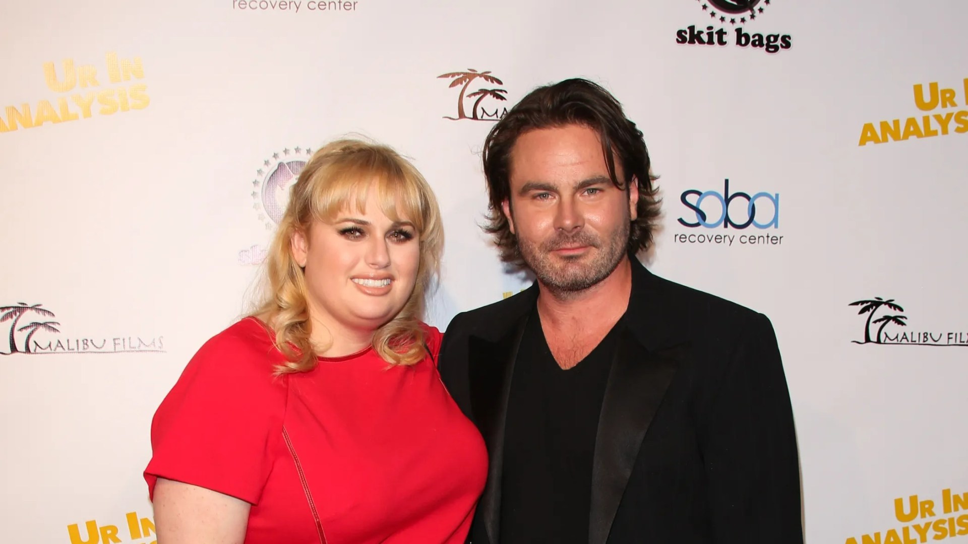 Uncovering the Truth: Mickey Gooch Jr.’s Relationship Timeline with Rebel Wilson Revealed