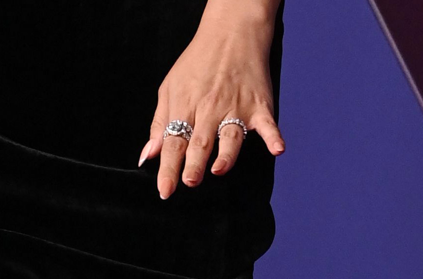 Selena Gomez flashing a ring on her wedding finger on the carpet