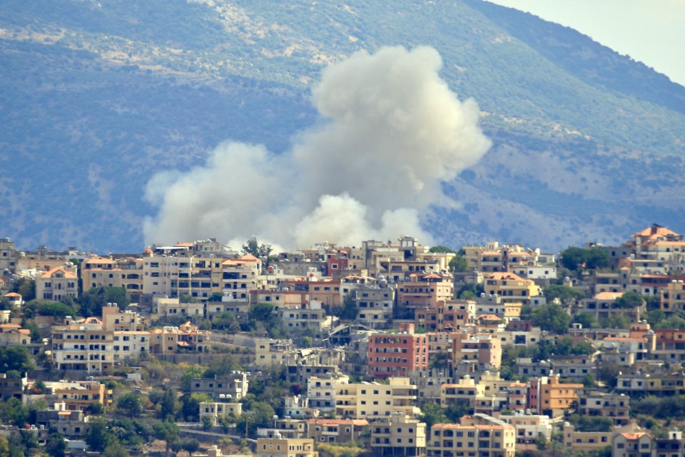 Smoke billows from the site of an Israeli airstrike in southern Lebanon today