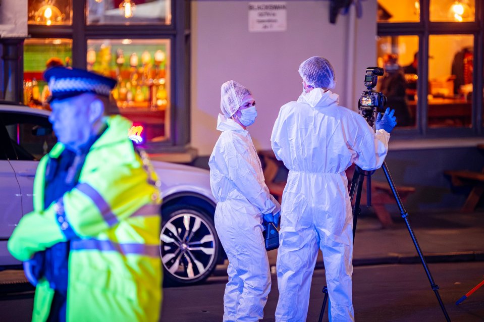 Police administering first aid at the scene