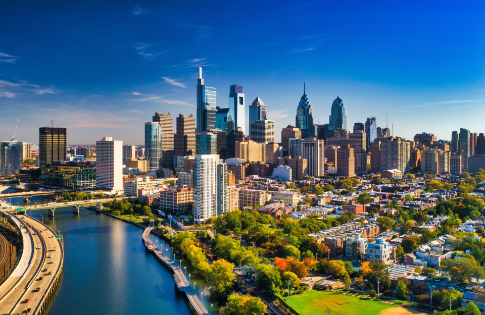 A look at Philadelphia's skyline with an aerial view of the Schuylkill River, Schuylkill Expressway, and residential neighborhoods