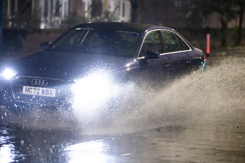 Cars navigating rainy conditions