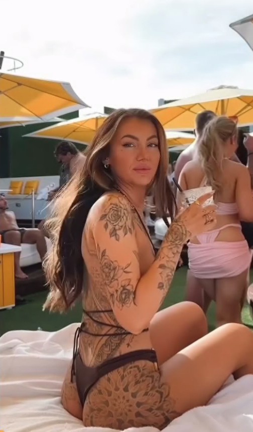 Abi showed off her tattoos in a cheeky clip from Ibiza