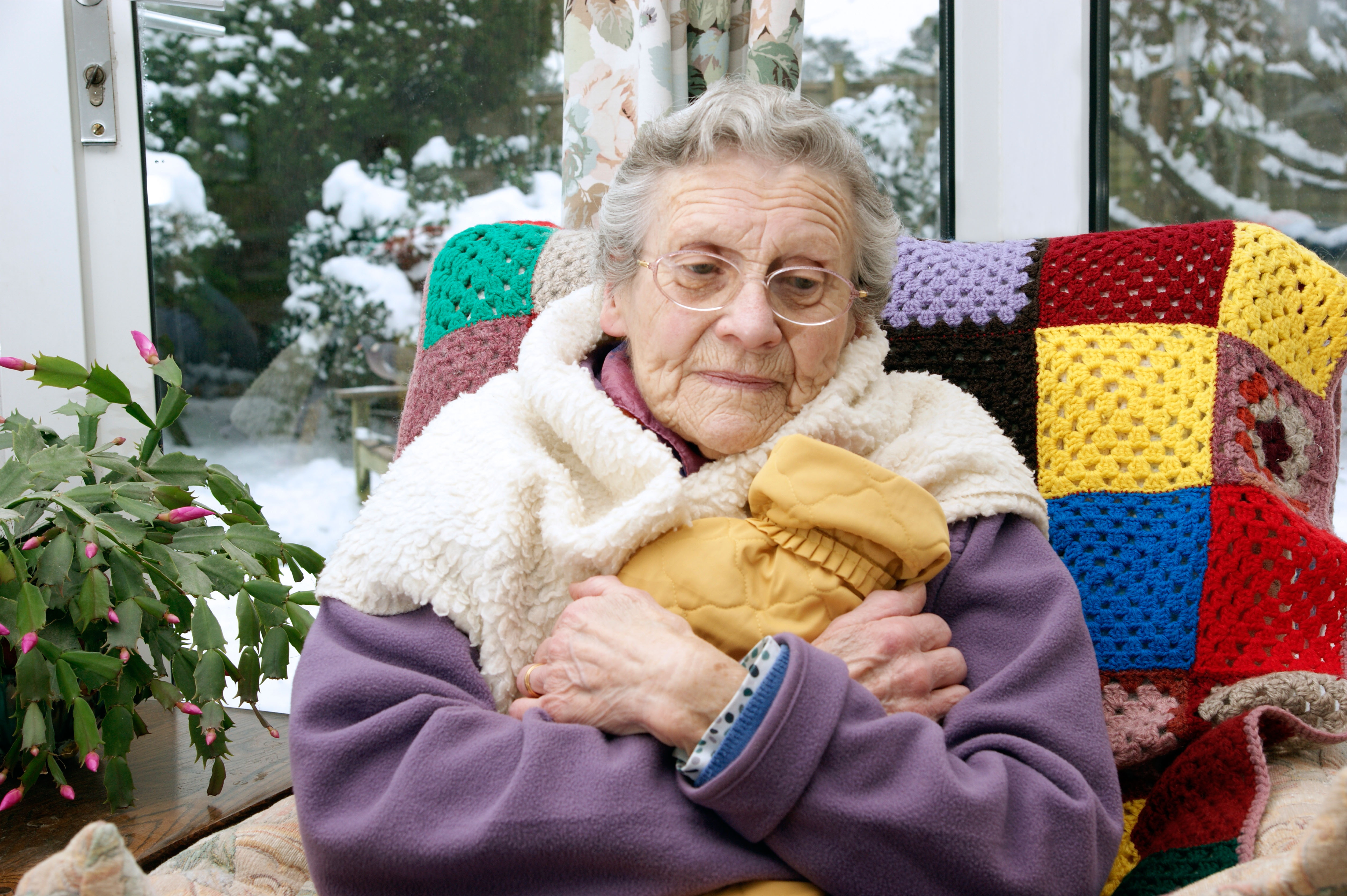 Elderly Woman Keeping Warm