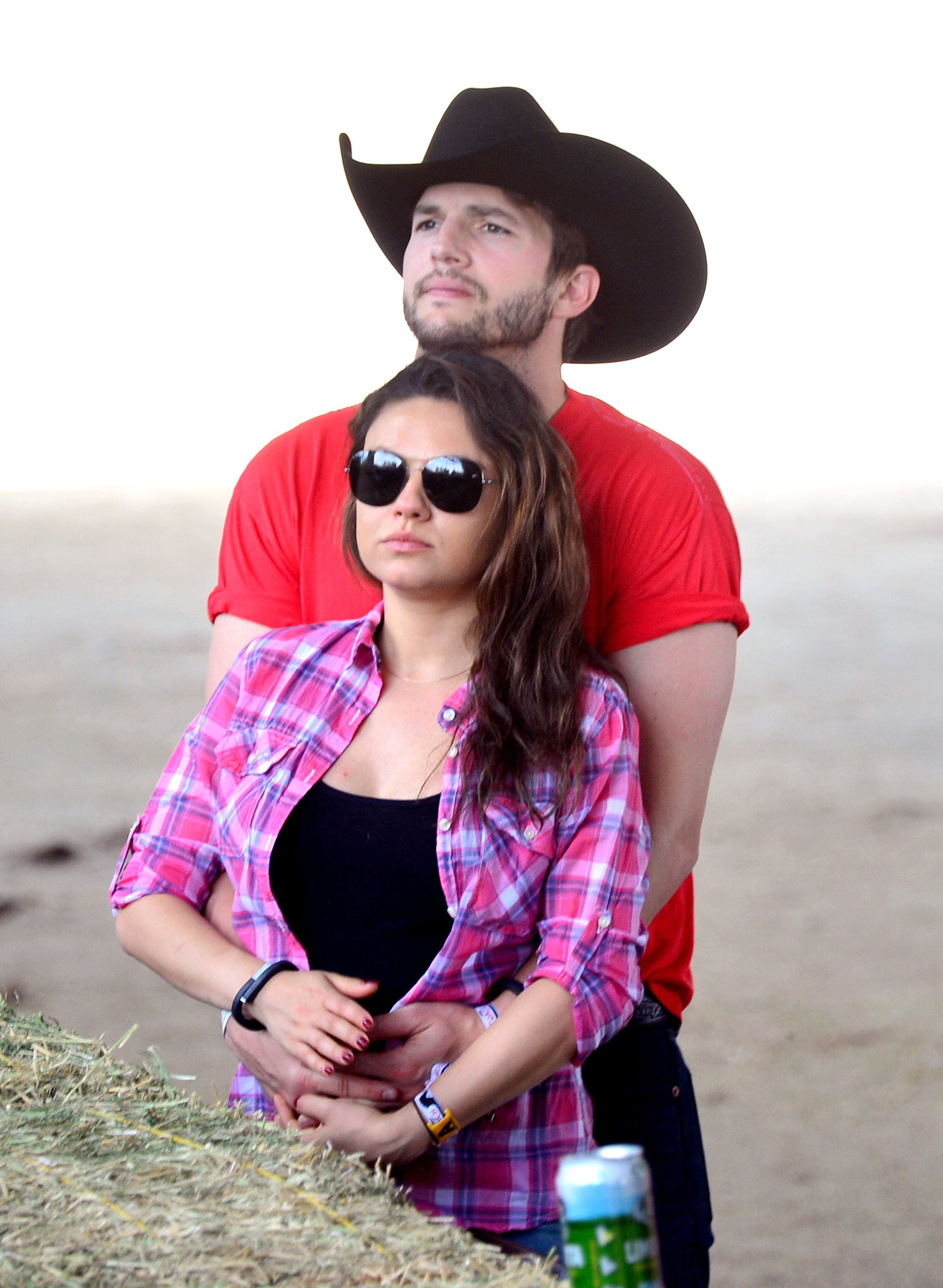 Ashton Kutcher and Mila Kunis attend day 1 of 2014 Stagecoach: California's Country Music Festival on April 25, 2014 | Source: Getty Images